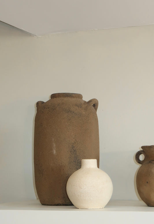 Tall Brown Vase with handles styled on a shelf